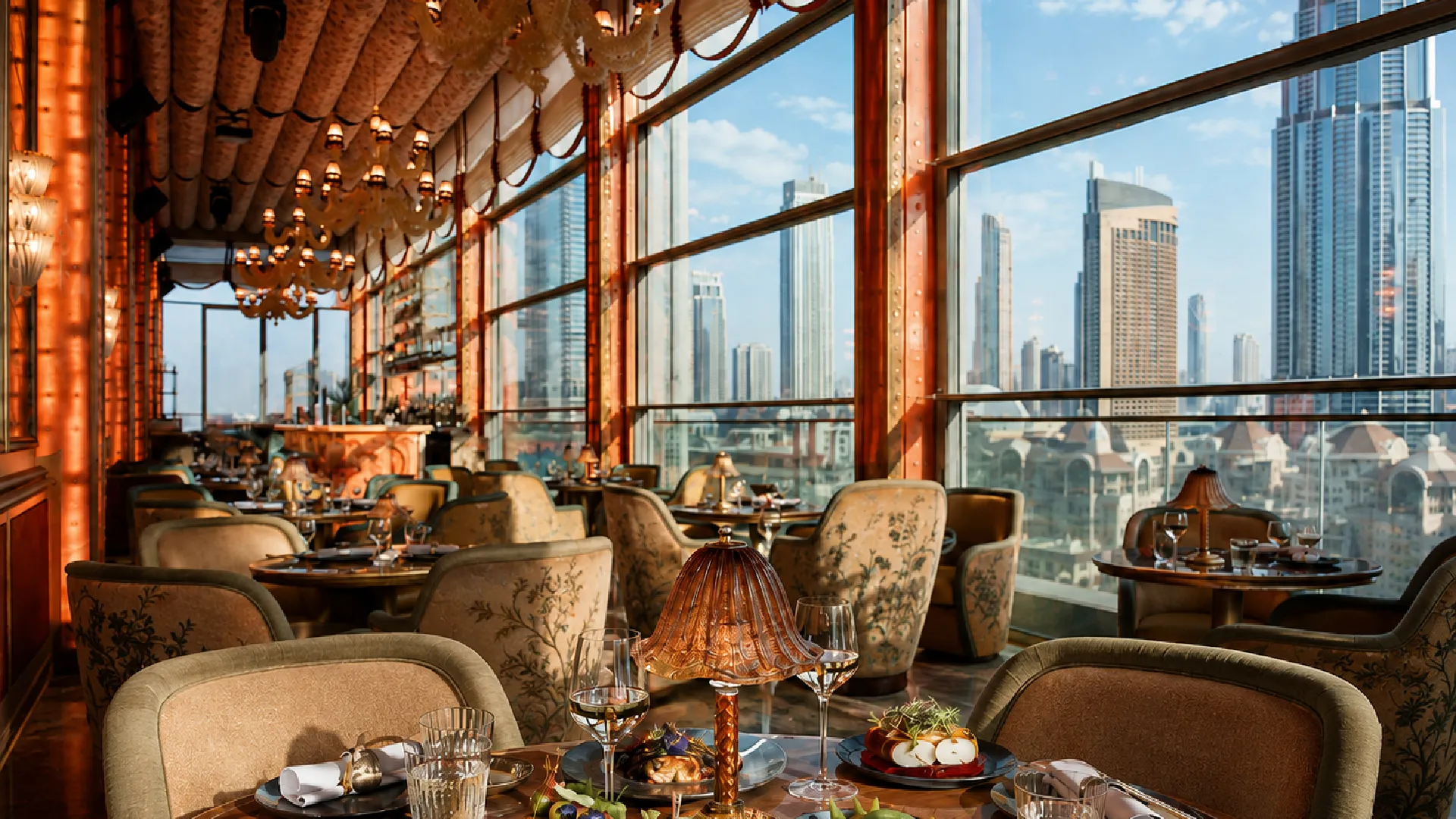 Elegant business lunch setting at Sexy Fish Dubai with refined dining tables, warm décor, and panoramic Dubai skyline views.