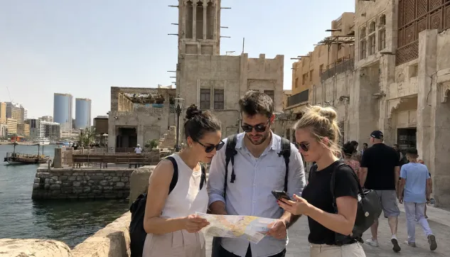 visitors planning their trip while exploring al seef in dubai