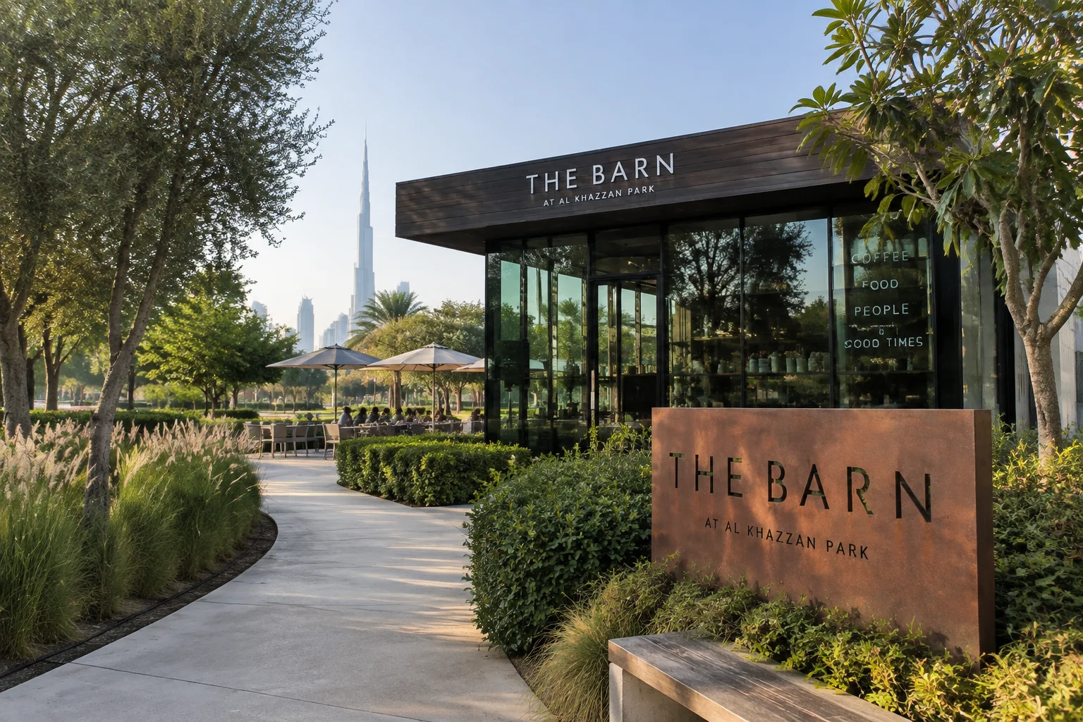 The Barn café building surrounded by greenery in Al Khazzan Park