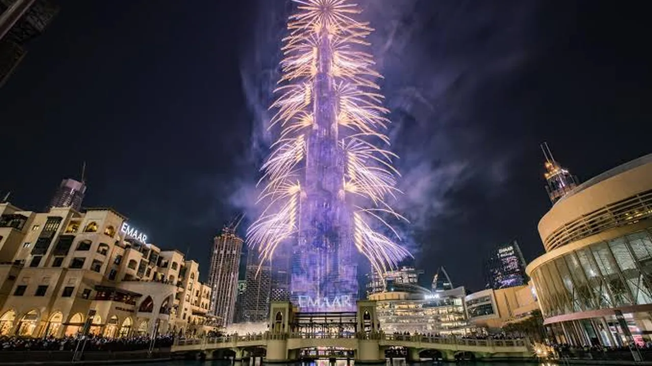 New Year's Eve fireworks bursting over the Burj Khalifa above the Dubai Mall fountain area