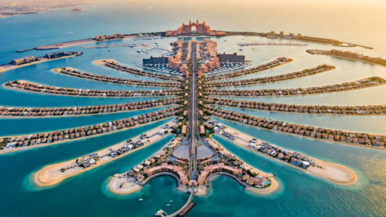 Aerial view of Palm Jumeirah hotels with Atlantis on the crescent at sunset