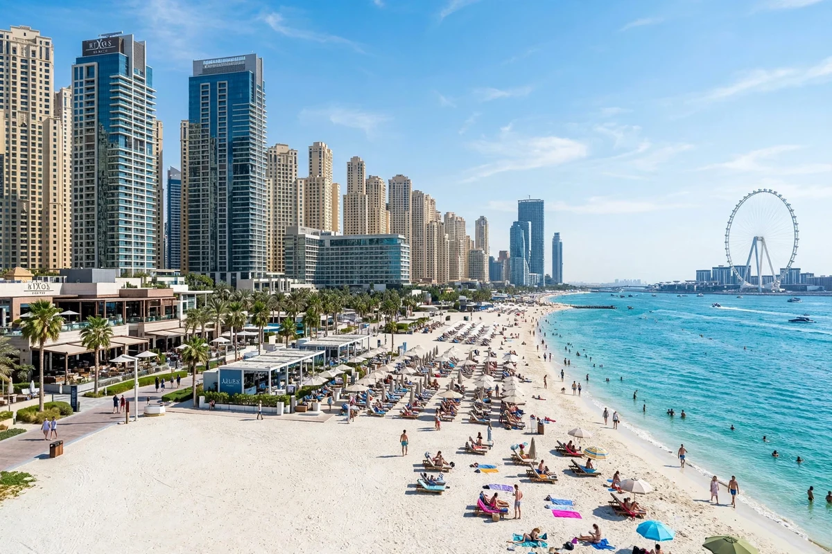 JBR Beach in Dubai with people swimming and the Ain Dubai wheel in the distance, a free public beach day