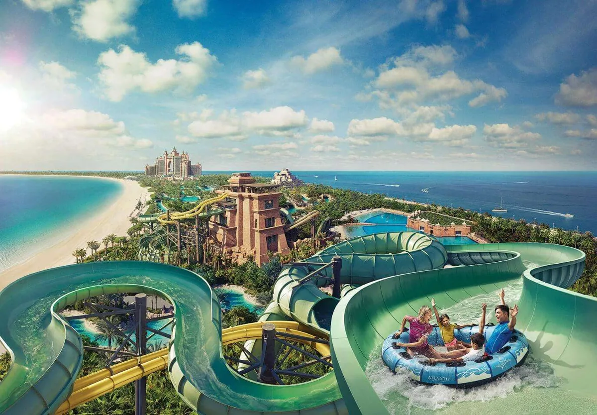 Aerial view of Aquaventure Waterpark slides with Atlantis, The Palm and the private beach, included with aquaventure waterpark tickets