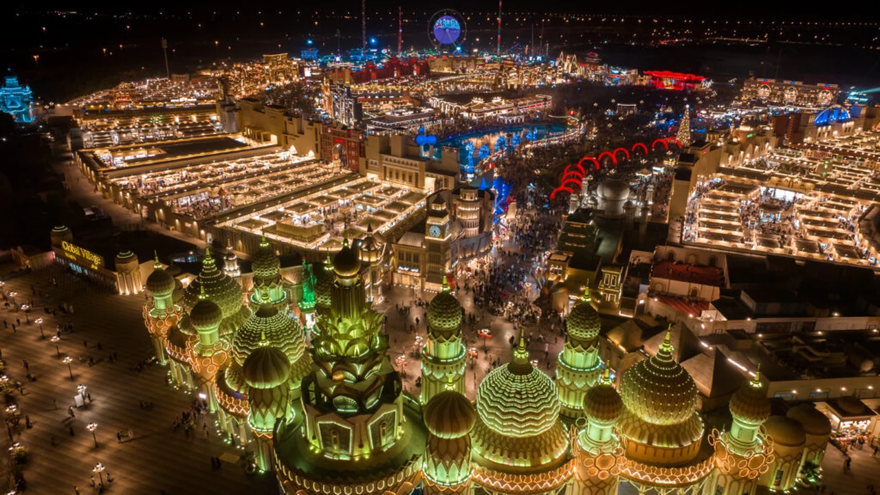Global Village pavilions lit up at night during the Dubai winter season